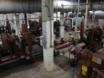 <p>Flow of the wastewater is overhead in all of the grey piping<br>All of the brown equipment is the six primary sludge pumps.</p>