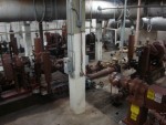 <p>Flow of the wastewater is overhead in all of the grey piping<br>All of the brown equipment is the six primary sludge pumps.</p>