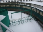 <p>Return activated sludge (RAS) is collected through the rapid sludge return (RSR) system in each clarifier. &nbsp;The RSR system consists of a series of pipes extending from points along the radius of the rotating rake mechanism to the sludge collection chamber in the center of each clarifier. &nbsp;The collected sludge is then pumped to the aeration tank influent pipe for recycle, or pumped to the primary clarifiers for co-settling with primary sludge.</p>